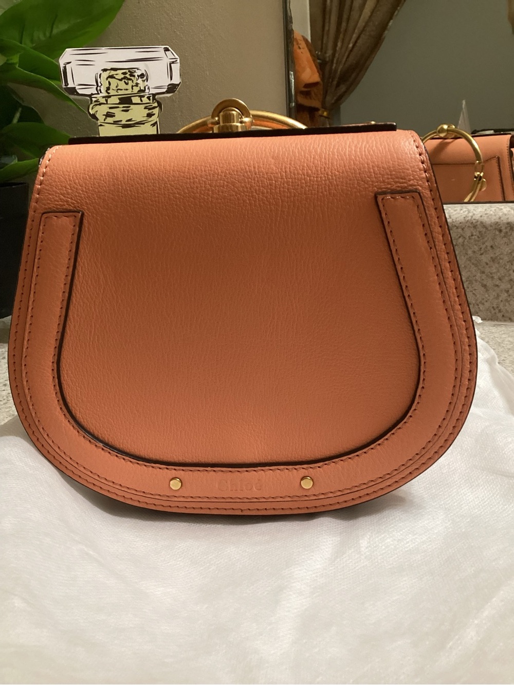 Chloe bracelet crossbody purse.